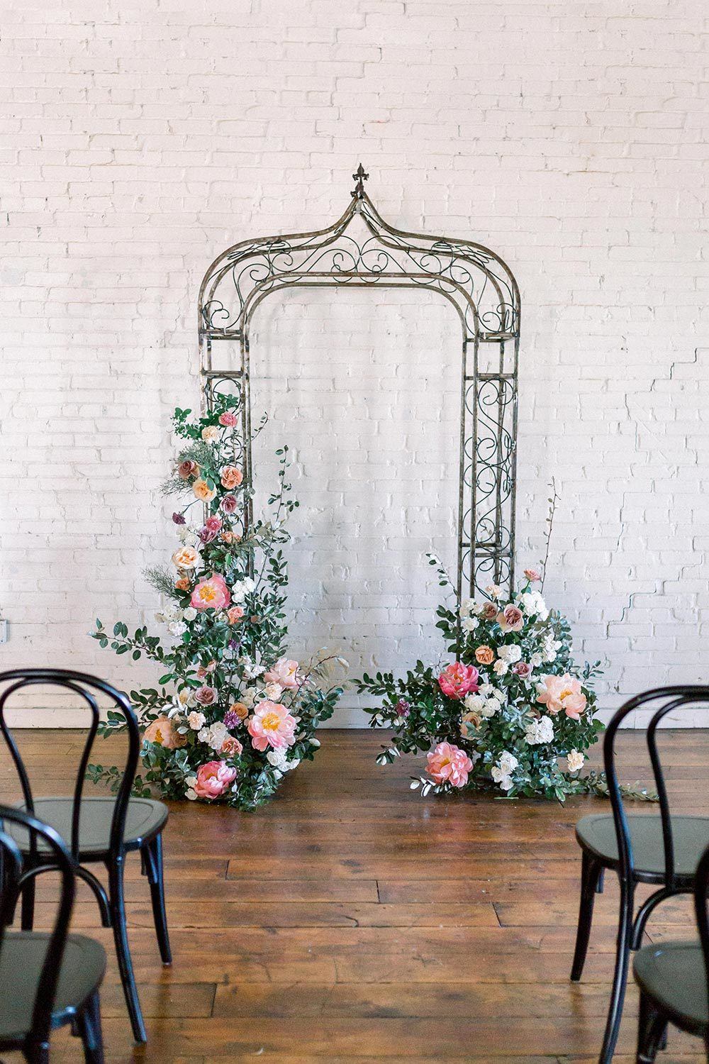 lavender and pink floral arbor wedding ceremony backdrop