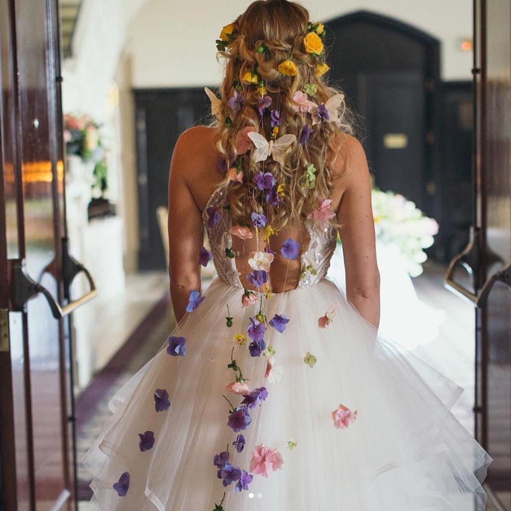 Hayley Paige ruffled wedding dress with fresh flowers